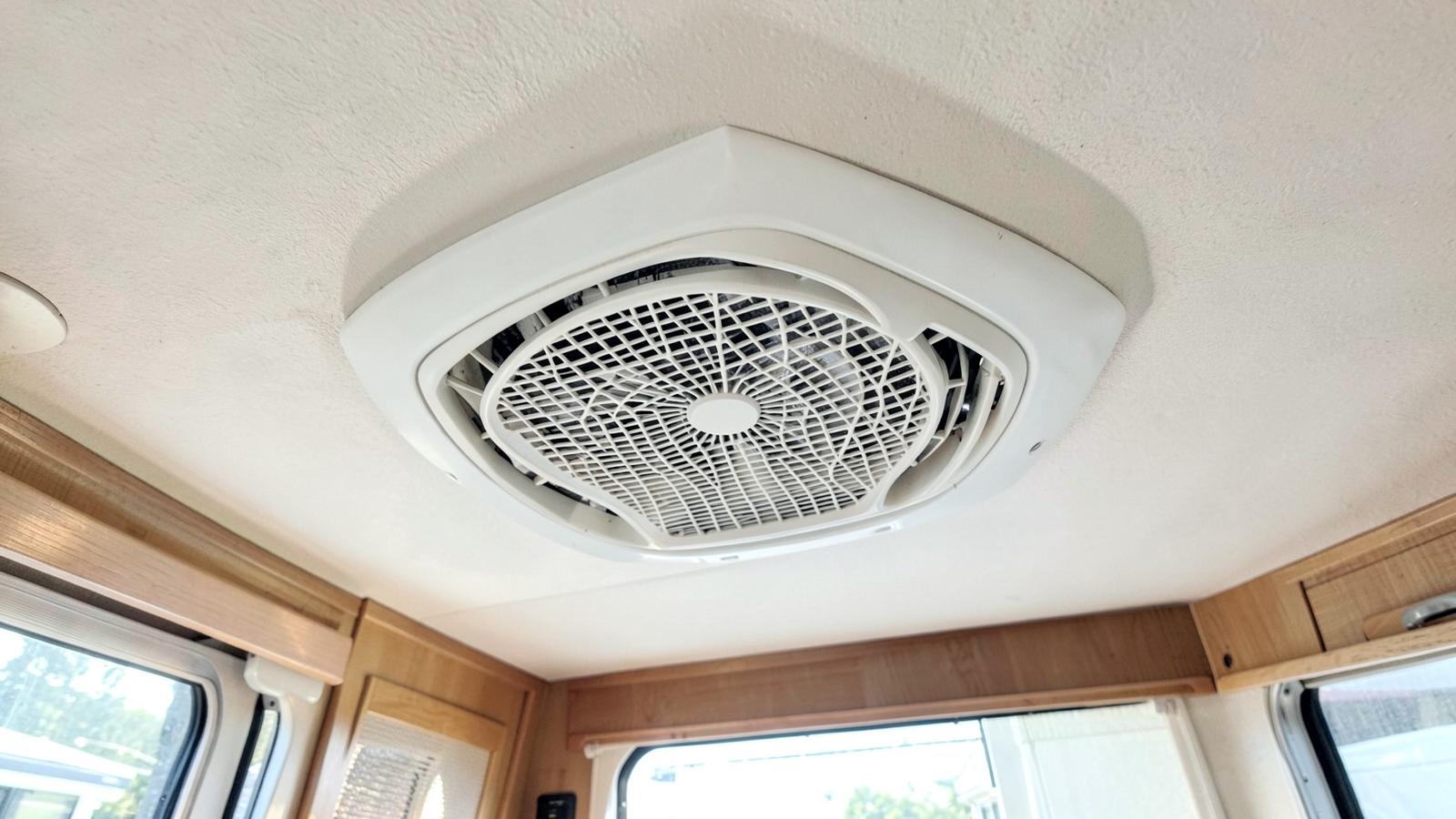 Ceiling air distribution vent of an RV air conditioner seen from inside the cabin