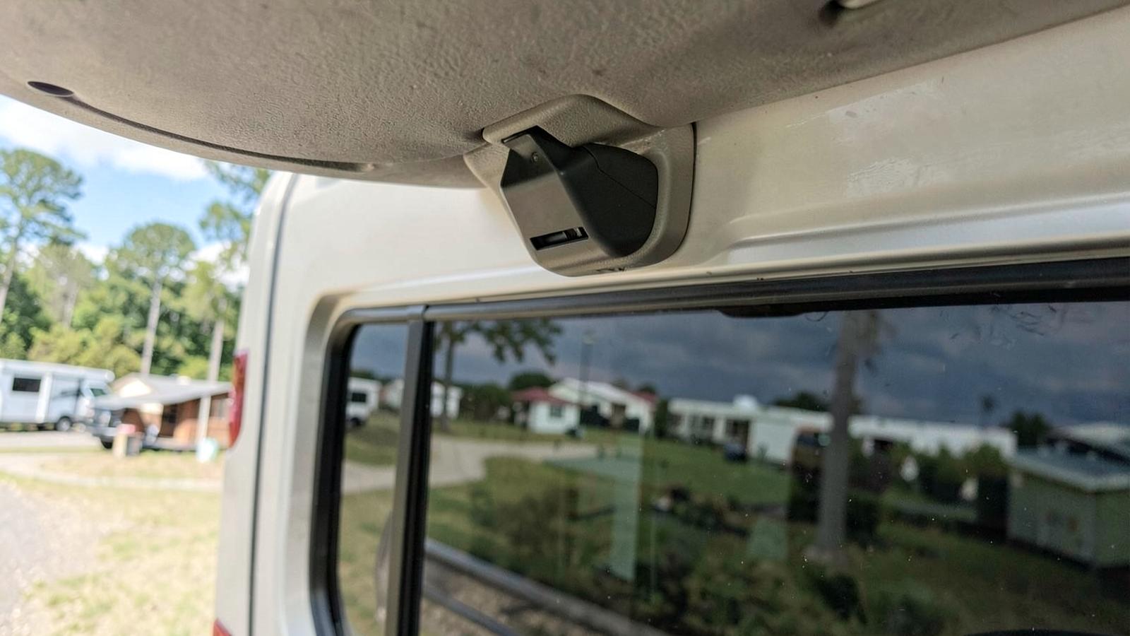 Rear-view camera mounted above the back window of a motorhome