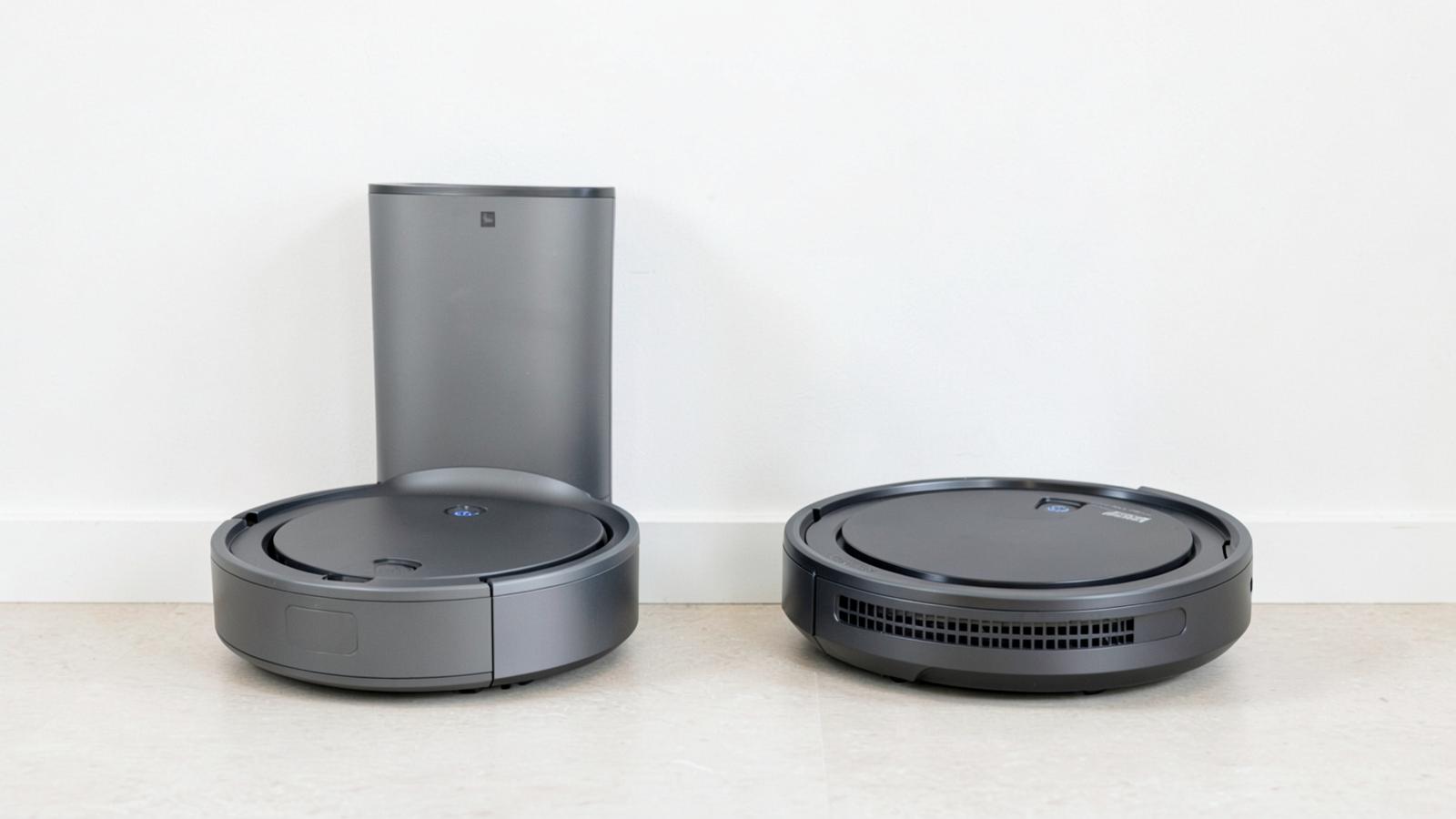Two different robot vacuum docking stations standing side by side